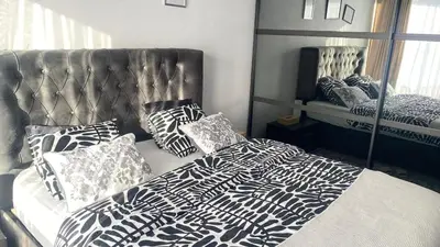 a bedroom with a bed with pillows on it at Strelitzyahouse in Brussels
