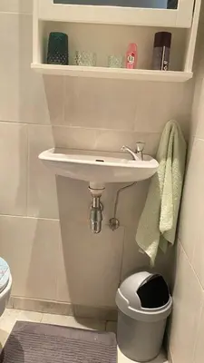 a bathroom with a sink and a toilet at Strelitzyahouse in Brussels