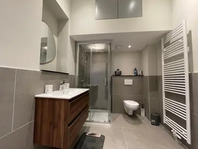 a bathroom with a sink and a shower and a toilet at Midi Station 2 in Brussels