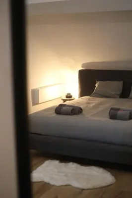 a bedroom with a bed with two pillows on it at Cozy Apartment in Antwerp central in Antwerp