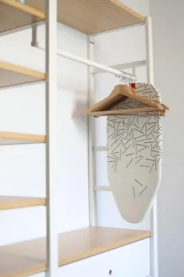 a shelf in a room with a vase on it at Cozy Apartment in Antwerp central in Antwerp