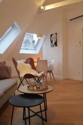 a living room with a couch and chairs at Charming Apartment with Cathedral View! On the 4th floor in Antwerp
