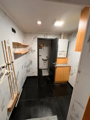 a bathroom with a sink and a toilet in a room at Doppelzimmer im Herzen Brüssels in Brussels