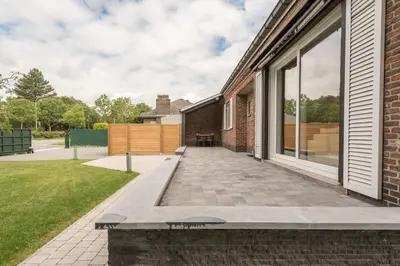 an external view of a house with a patio at Holiday home Zelenachten in Zele