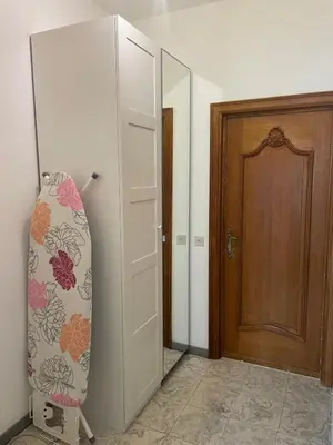 a room with a door and a surfboard next to a door at JV House in Zellik