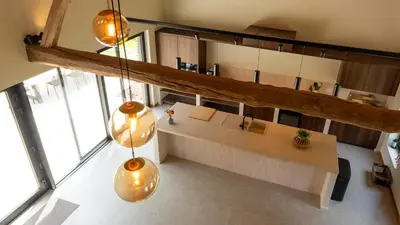 an overhead view of a room with a table and some lights at Gezellig vakantiehuis voor 12 personen in Boutersem