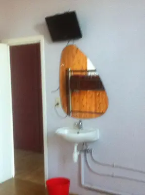 a bathroom with a sink and a mirror on the wall at The82 Hostel Louise in Brussels