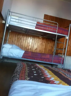 a bedroom with two bunk beds in a room at The82 Hostel Louise in Brussels