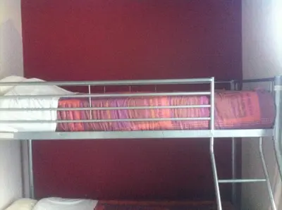a bunk bed with towels on the bottom bunk at The82 Hostel Louise in Brussels