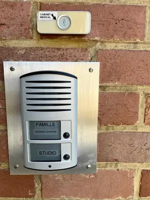 a utility box on the side of a brick wall at Studio vintage banlieue BXL in Genval