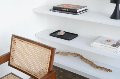 a white desk with a shelf with books and a snake at Appartement t'Zuid with underground parking in Antwerp