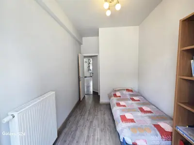 a small room with a bed in the corner at Splendid 2 bedroom apartment in Etterbeek in Brussels