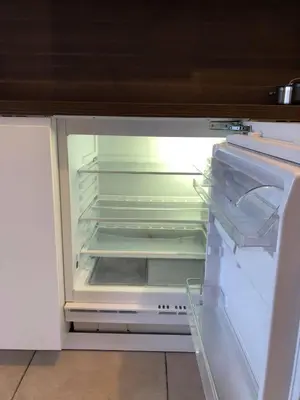 an empty refrigerator with its door open in a kitchen at Apartment Fruithof Tack in Sint-Gillis-Waas