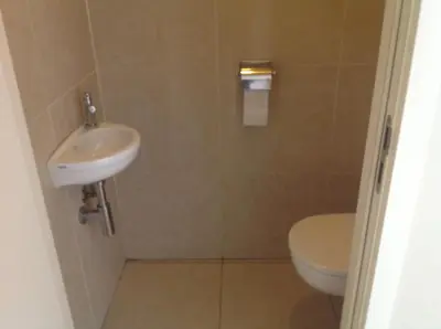 a bathroom with a sink and a toilet at Apartment Fruithof Tack in Sint-Gillis-Waas
