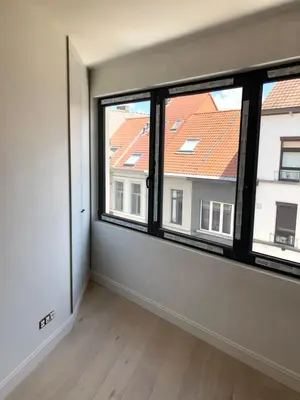 an empty room with a large window with a view at Holiday Small Shared Room in Gent in Ghent