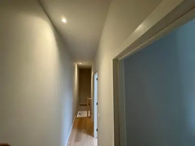 a room with a ceiling and a hallway at Holiday Small Shared Room in Gent in Ghent