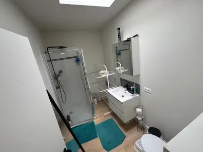 an overhead view of a bathroom with a shower and a sink at Holiday Small Shared Room in Gent in Ghent