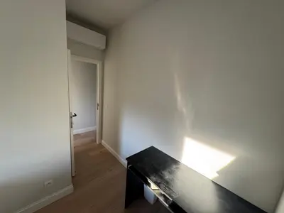 an empty room with a table and a hallway at Holiday Small Shared Room in Gent in Ghent