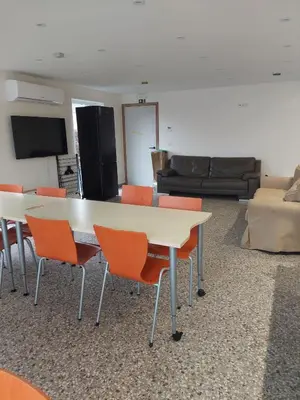 a room with a table and chairs and a couch at Krie 2 by Luttelkolen in Tielt