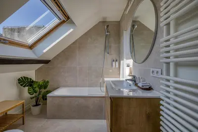 a bathroom with a sink and a bath tub at Mas Europe by Sweett in Brussels