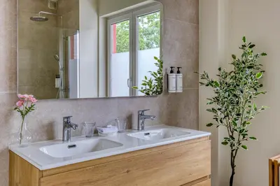 a bathroom with a sink and a mirror at Mas Europe by Sweett in Brussels