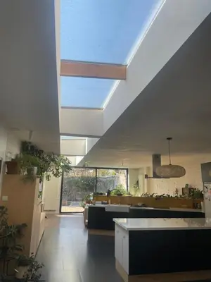 a living room with a couch and a ceiling at Spacious house with big garden close to the city in Ghent