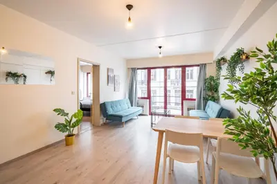 a living room with a table and chairs at Bright and Central Antwerp Apartments in Antwerp