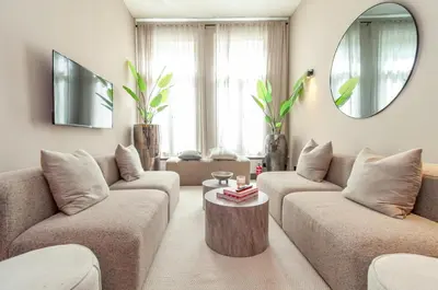 a living room with two couches and a coffee table at Holiday Home in Antwerp in Antwerp