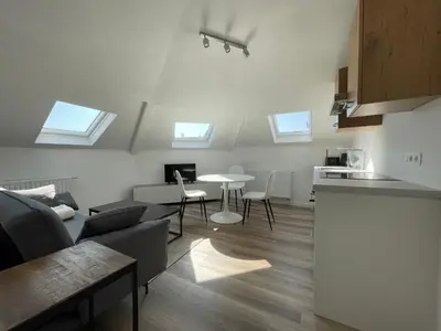 a living room with a couch and a table at Midi Station 3 in Brussels