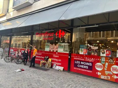 a man standing in front of a store at Charming Studio in Central Brussels - Walk Everywhere! in Brussels
