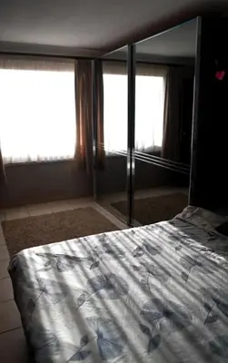a bedroom with a bed and a large mirror at Beautiful 4 bedroom Villa close to Antwerp in Zwijndrecht