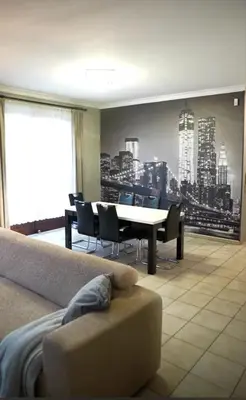 a dining room with a table and chairs at Beautiful 4 bedroom Villa close to Antwerp in Zwijndrecht
