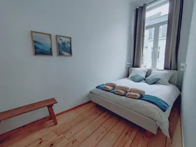 a small bedroom with a bed and a window at Sainte Catherine Apartments in Brussels