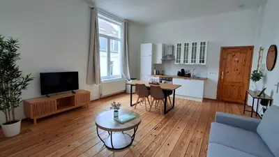 a living room with a couch and a table at Sainte Catherine Apartments in Brussels