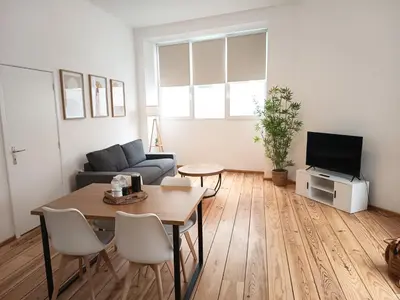 a living room with a couch and a table at Sainte Catherine Apartments in Brussels