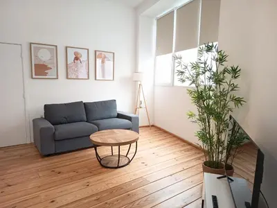 a living room with a couch and a table at Sainte Catherine Apartments in Brussels