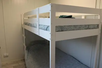 a pair of bunk beds in a room at Uniek privé natuurdomein voor 14 personen in Evergem