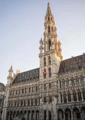 a large building with a clock tower on top of it at Royal Grand Place Loft in Brussels