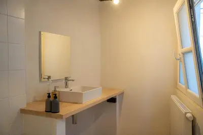 a bathroom with a sink and a mirror at Royal Grand Place Loft in Brussels
