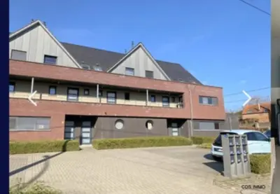 a building with a car parked in front of it at Doris in Tielt
