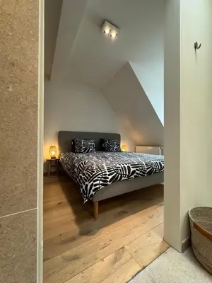a bedroom with a zebra print bed in a attic at Downtown Spacious Design Duplex 3bedR in Brussels