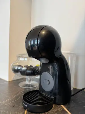 a black coffee maker sitting on top of a counter at Downtown Spacious Design Duplex 3bedR in Brussels
