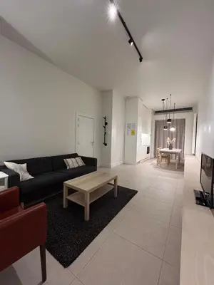 a living room with a couch and a coffee table at Studio Tzawel in Ghent