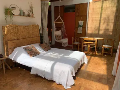 a bedroom with a bed and a table and chairs at The Bohemian House Melle in Melle