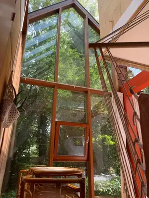 a window in a room with a view of trees at The Bohemian House Melle in Melle