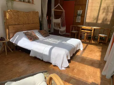 a bedroom with a bed and a table and chairs at The Bohemian House Melle in Melle