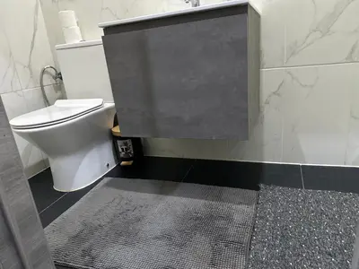 a bathroom with a toilet and a shower stall at Sweet apartment with belcon in Brussels