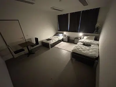 a living room with two beds and a couch at Stay Here in Erpe-Mere