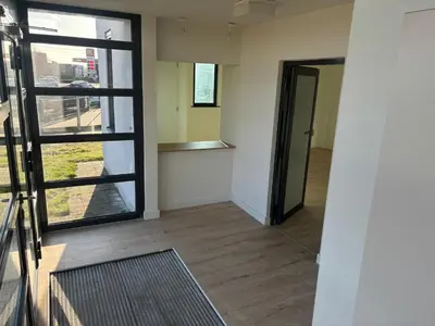 an empty room with a door and a window at Stay Here in Erpe-Mere