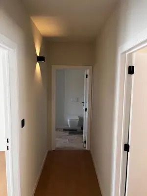 a hallway of a bathroom with a toilet at Appartement ' Tintin Travels' in Geel